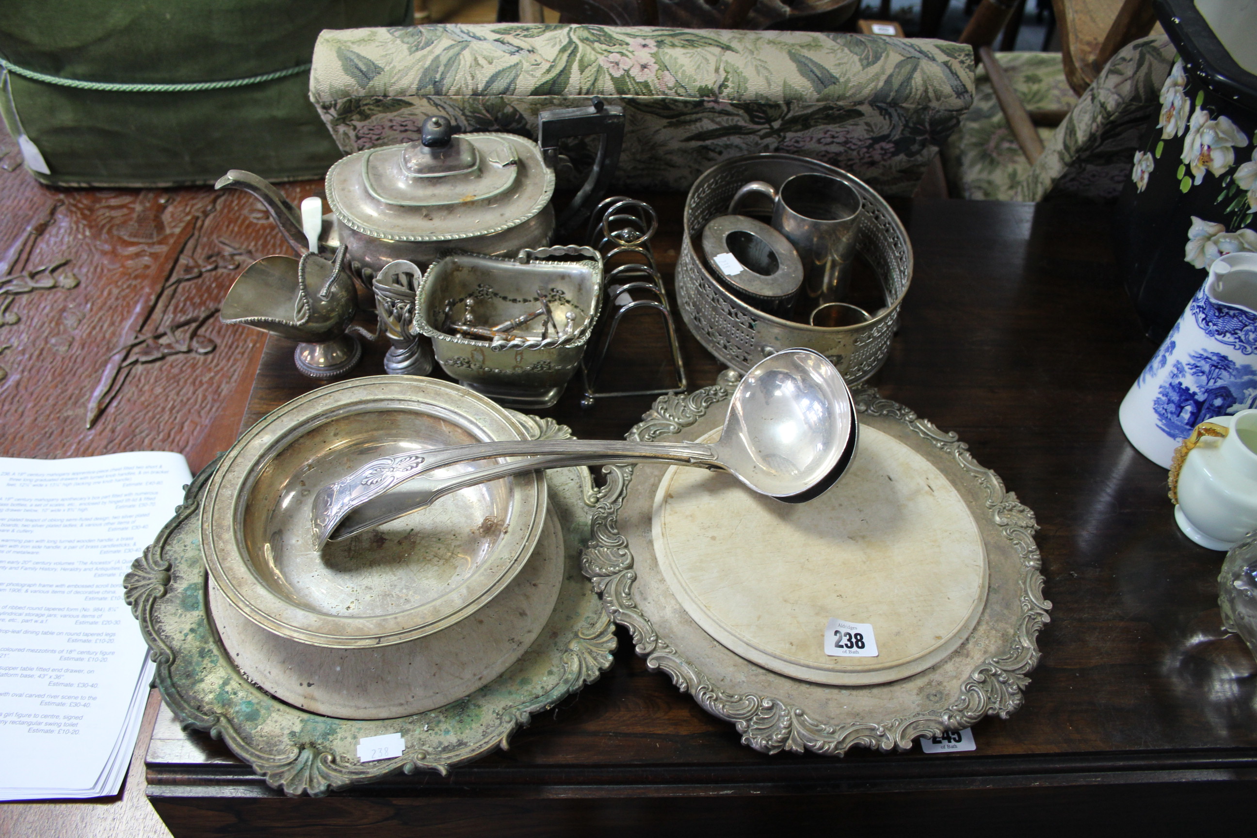 A silver plated teapot of oblong semi-fluted design; two silver plated bread boards; two silver
