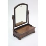 An early 20th century mahogany rectangular swing toilet glass fitted long drawer to the box base,