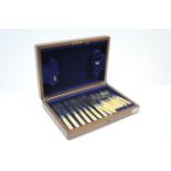 Nine EPNS fish knives & eight ditto fish forks with ivorine handles, & in fitted mahogany case.