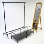 A black finish & silvered-metal clothes rail; an Ikea “Vittsjo” coffee table; & a rectangular cheval