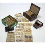 A collection of stereoscope cards contained in a mahogany trinket box & loose; & a stereoscope