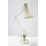 A Herbert Terry & Sons of Redditch white anglepoise desk lamp.