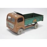 A Tri-Ang tinplate model “Regal Roadster Contract Co.” tipper truck, 18½" long.