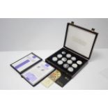A set of twenty-four Royal Mint sterling silver coins commemorating the life of H. M. Queen