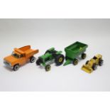 A Tonka toy model tractor & trailer; a ditto model flat-bed truck; & a ditto model loader.