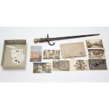 An antique bayonet, 21¾" long (w.a.f.); together with various loose postcards & cigarette cards.