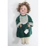 An Armand Marseille bisque head girl doll (Germany 992 A.2.M.) with blue sleeping eyes, open
