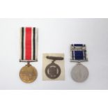 The Special Constabulary Long Service Medal (Geo.V), awarded to Albert E Hammend; the Police Long