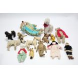 A Merrythought gold plush dog; three various teddy bears; and various other soft toys.