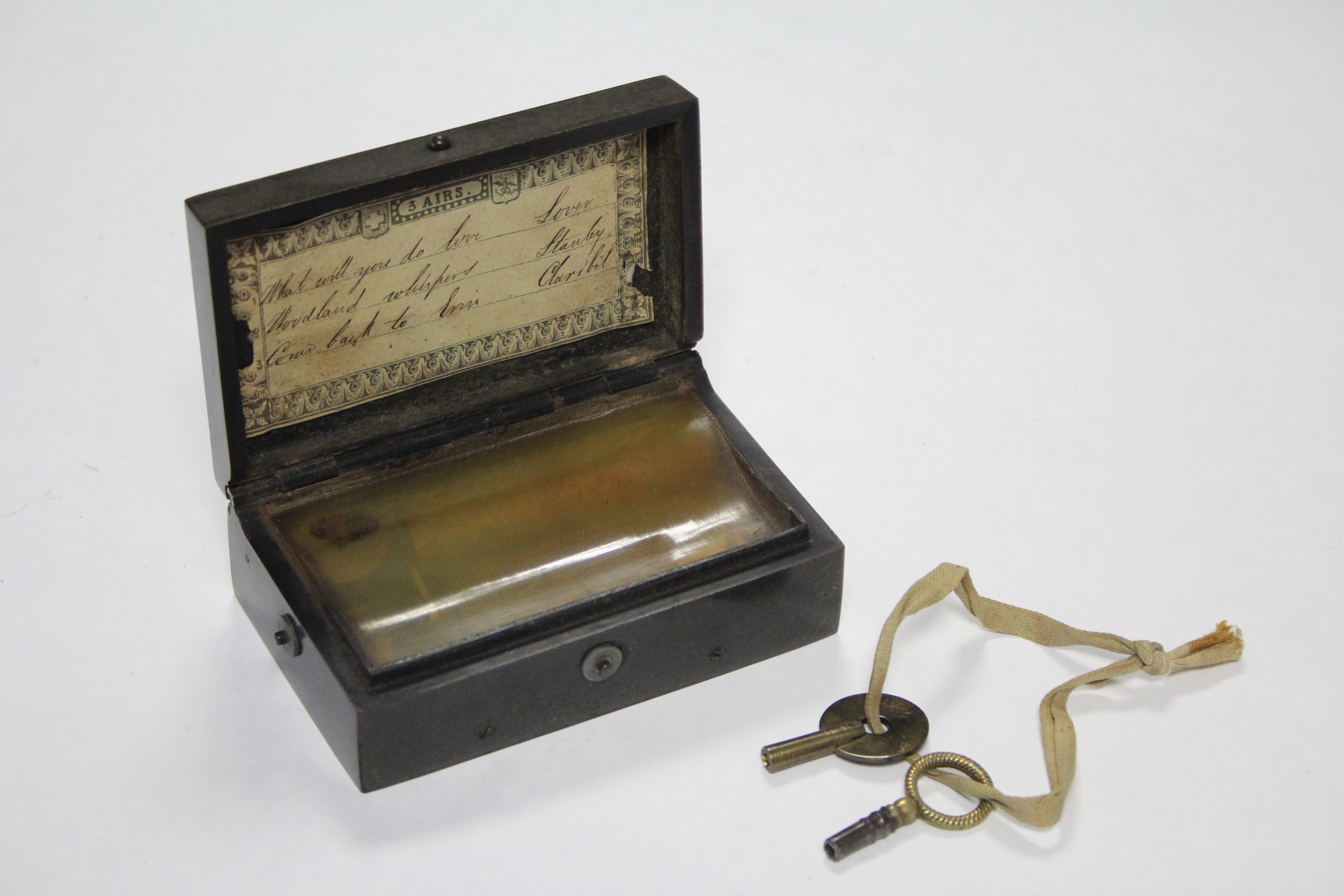 A late 19th/early 20th century Swiss music box playing three airs & in black Gutta Percha case