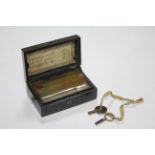 A late 19th/early 20th century Swiss music box playing three airs & in black Gutta Percha case