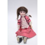 Another Armand Marseille large bisque head doll (A 13M) with sleeping eyes, painted features, and