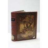 A leather-bound photograph album with inlaid-olivewood panel to the front & back.