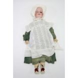 An Armand Marseille large bisque head doll (Germany 390 A 14 M) with sleeping eyes, painted