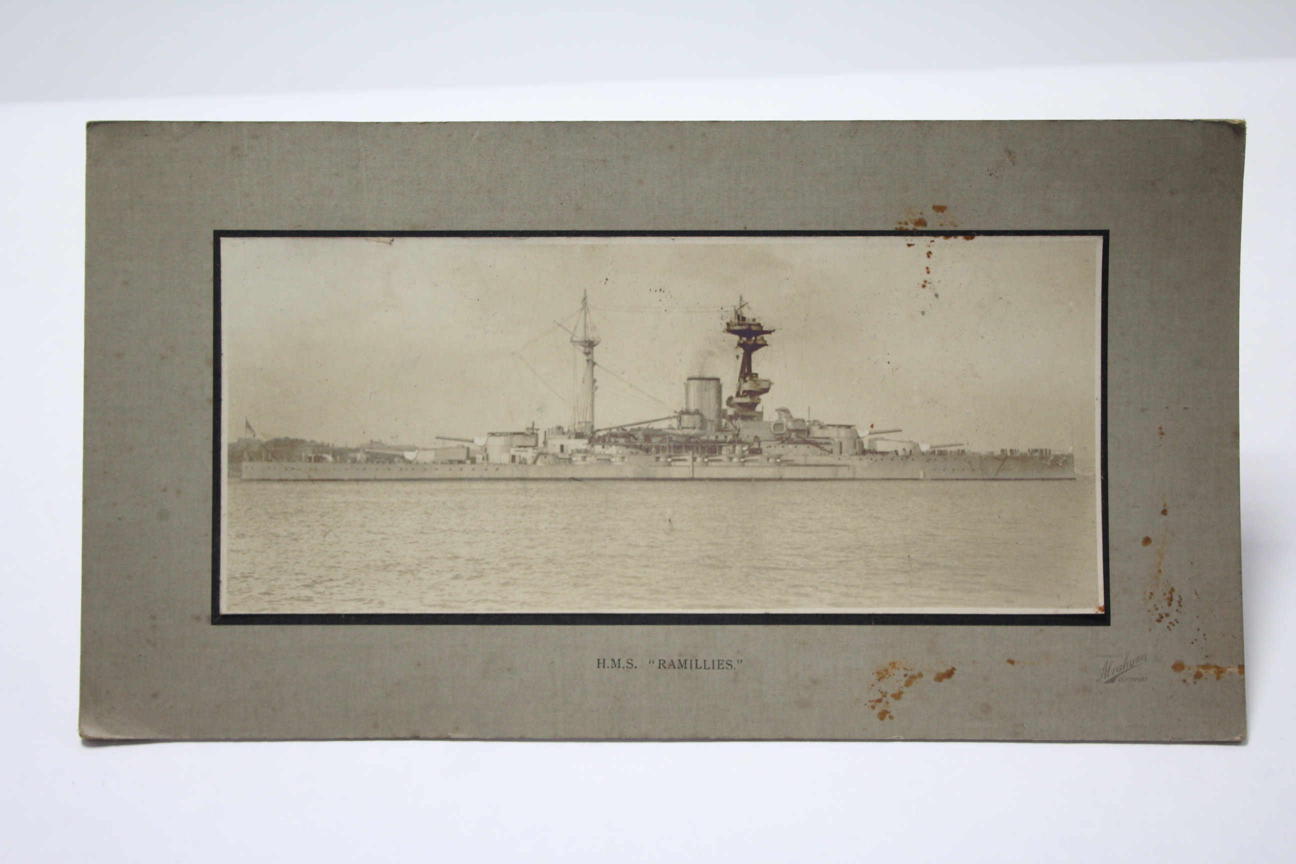 A Sepia photograph of the battleship “H. M. S. Ramillies”, 4¾” x 11¼”, mounted, un-framed; a