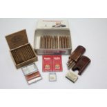 A leather pocket cigar case; a metal cigarette case; a pocket cigarette lighter; eleven King