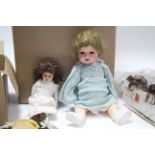 Two composition dolls; and various doll’s wigs, doll’s clothes, and other accessories.