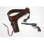 A replica of a U. S. 45 calibre pistol; & a tan leather cartridge belt.