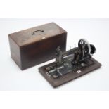 A late 19th/early 20th century hand sewing machine by J. Collier & Sons of London, with walnut