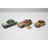 A Corgi scale model “James Bond Aston Martin DB5”; two Dinky scale models “Austin A30” (No.