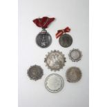 A WWII German Eastern Front Medal; two continental commemorative medals; & four Victorian Silver