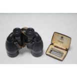 A pair of Ross “Solaross” 9 x 35mm binoculars, lacking case; & a Ronson Varaflame cigarette lighter,