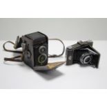 A Rolliecord box camera with leather case; & a Ross Ensign folding camera, lacking case.