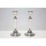 A pair of silver candlesticks on round leaded bases, 8¼” high, Birmingham 1960.