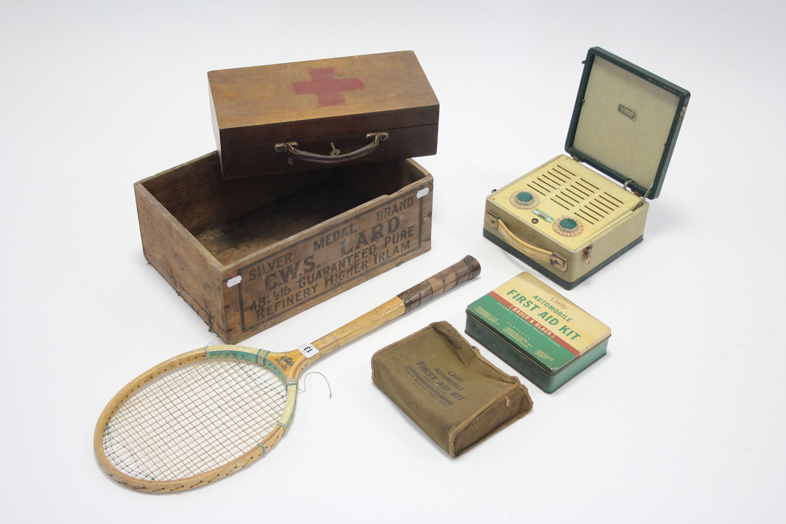 A Baronet wooden tennis racquet; a Vidor portable radio; a “C. W. S. LARD” wooden crate; a Curity “