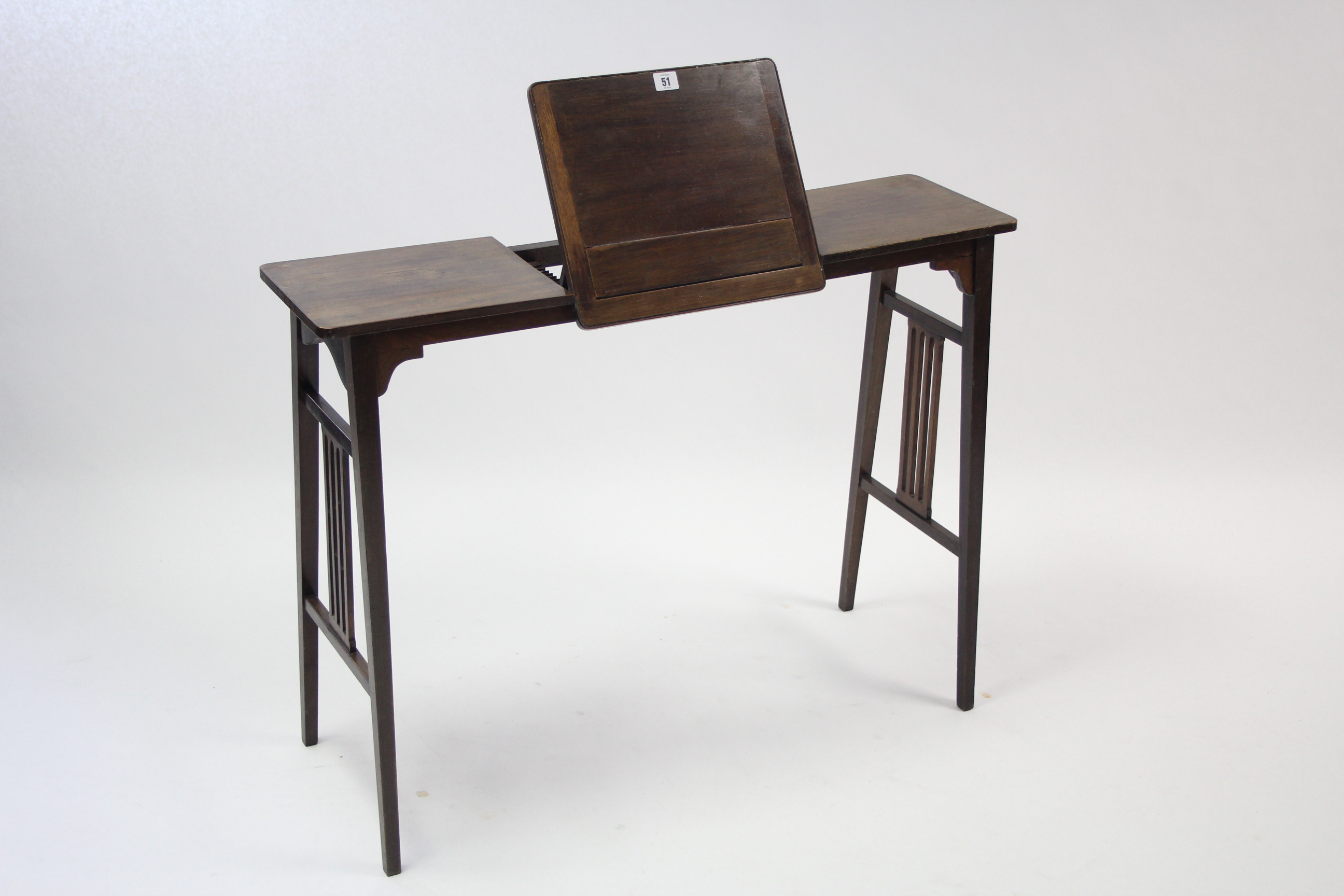 An Edwardian mahogany reading table with adjustable stand to centre, & on square tapered legs, 37”