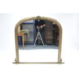 A Victorian giltwood overmantel mirror with scroll surmount to the rounded top, 53" wide x 47"