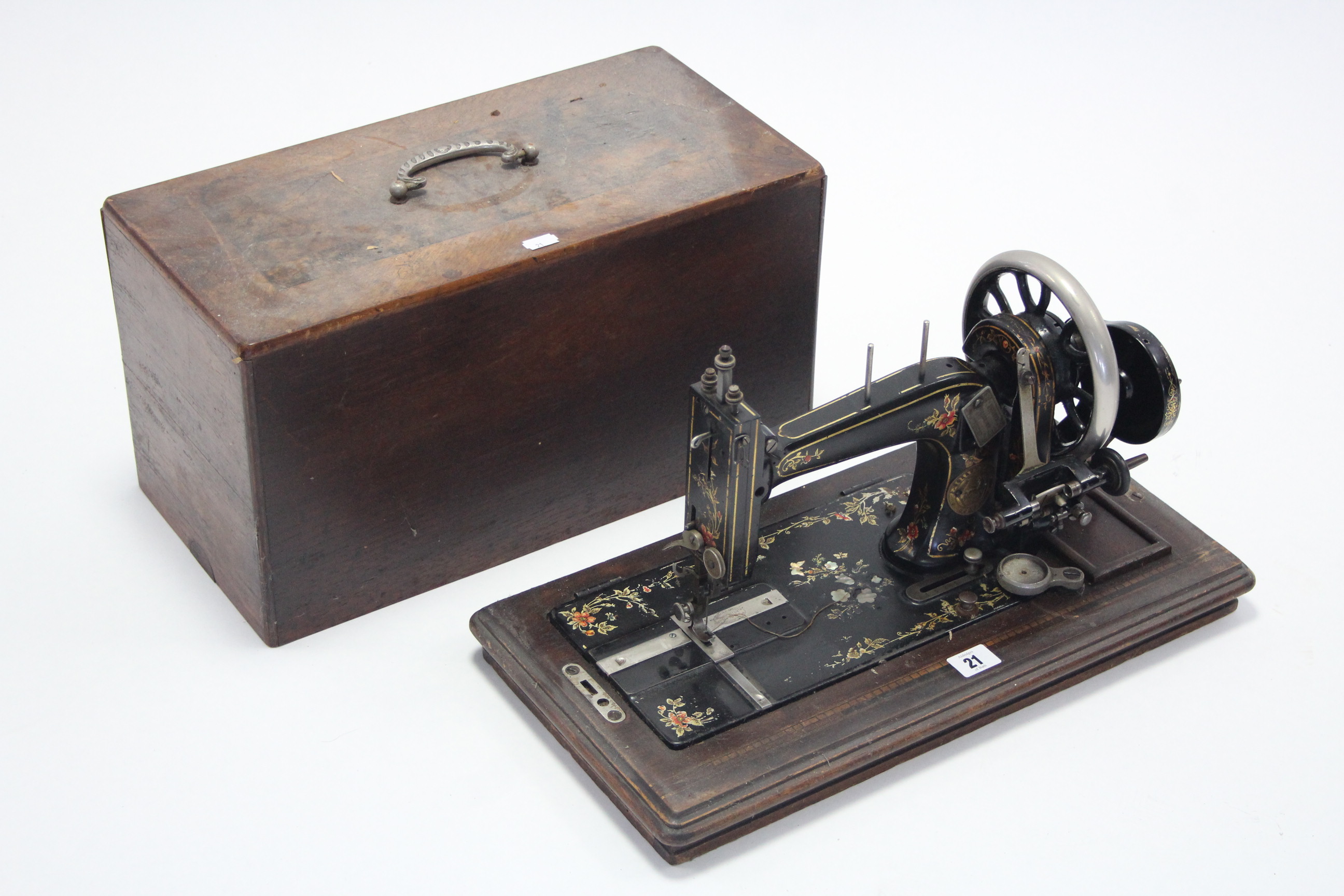 A late 19th/early 20th century hand sewing machine by J. Collier & Sons of London, with walnut