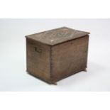 A late 19th/early 20th century pine storage box with carved lift-lid & on block feet, (slight