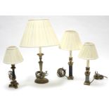 Four Besselink & Jones brass table lamps, each with cream coloured shade.