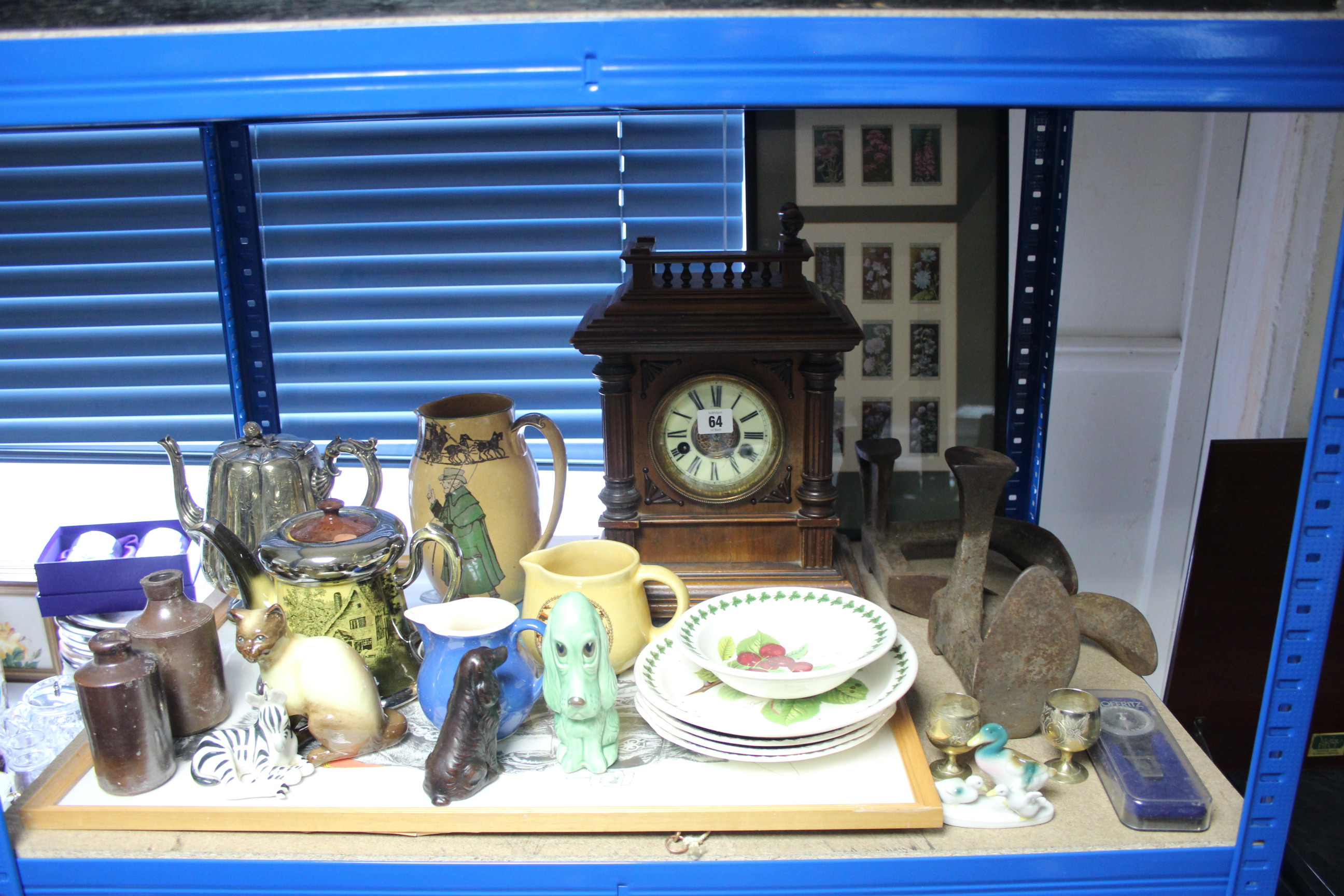 A late 19th/early 20th century mantel clock with striking movement, & in walnut case, 15" high (