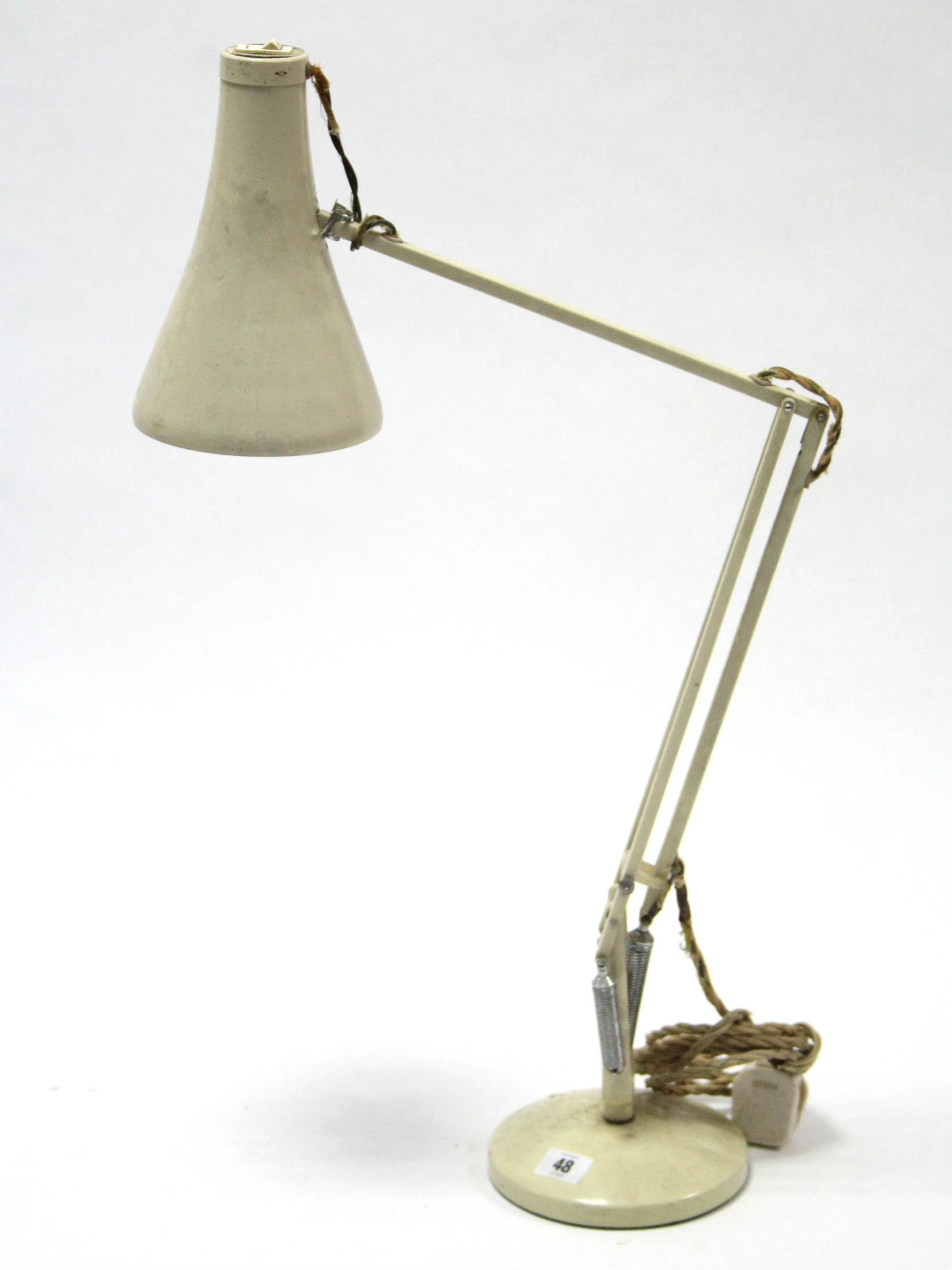 A Herbert Terry of Redditch cream anglepoise desk lamp.