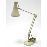 A Herbert Terry of Redditch cream anglepoise desk lamp.