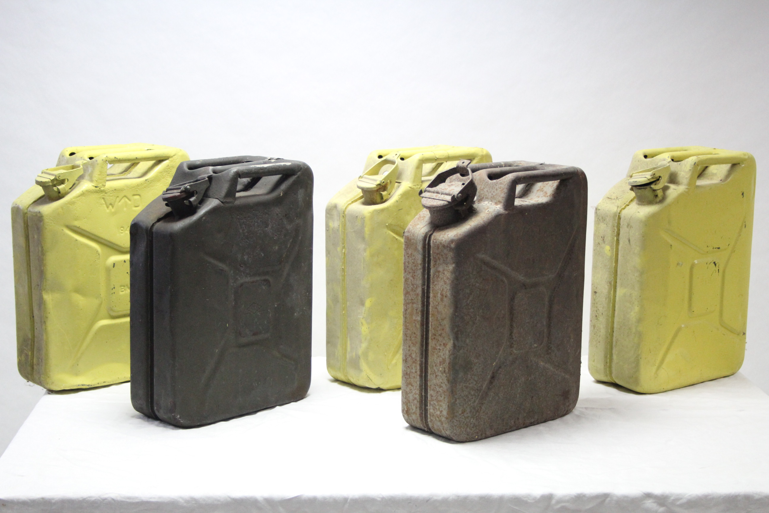 Five various painted & plain metal jerrycans