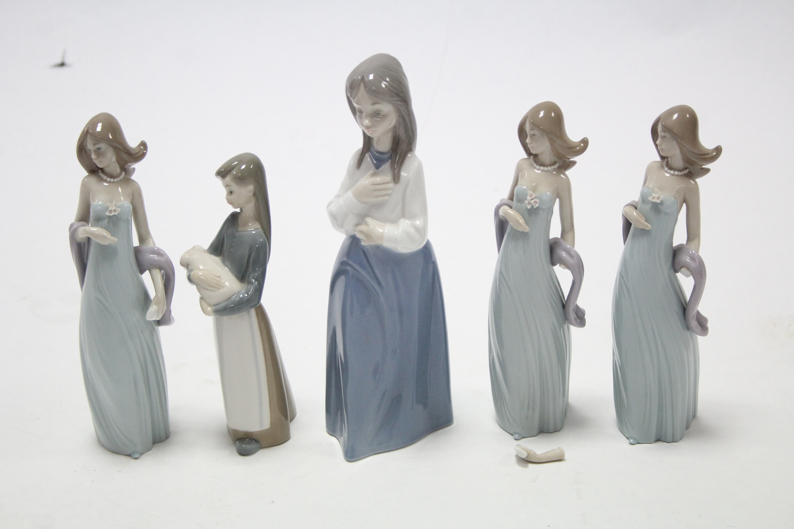 Five Lladro porcelain female figures, one w.a.f.