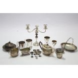 A silver plated three piece tea service of oval form; a silver plated twin-branch table