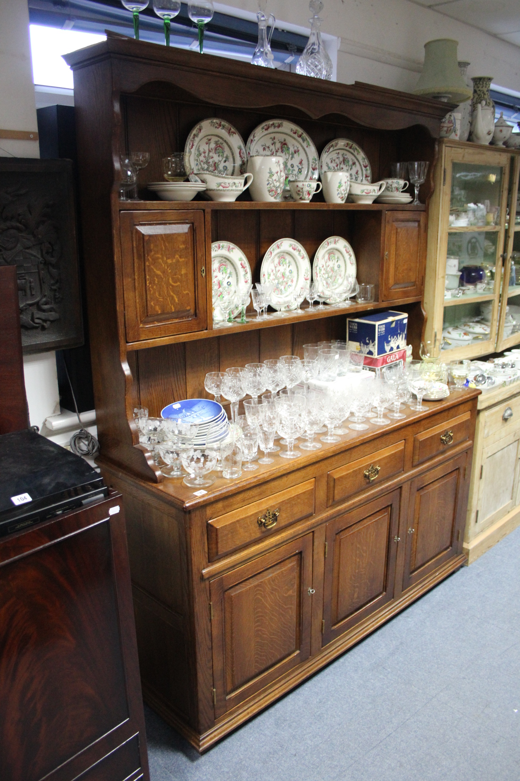 A good quality 19th century-style oak dresser, the upper part with open shelves & fitted cupboard to