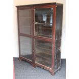 A late 19th/early 20th century walnut tall standing bookcase with eight adjustable shelves