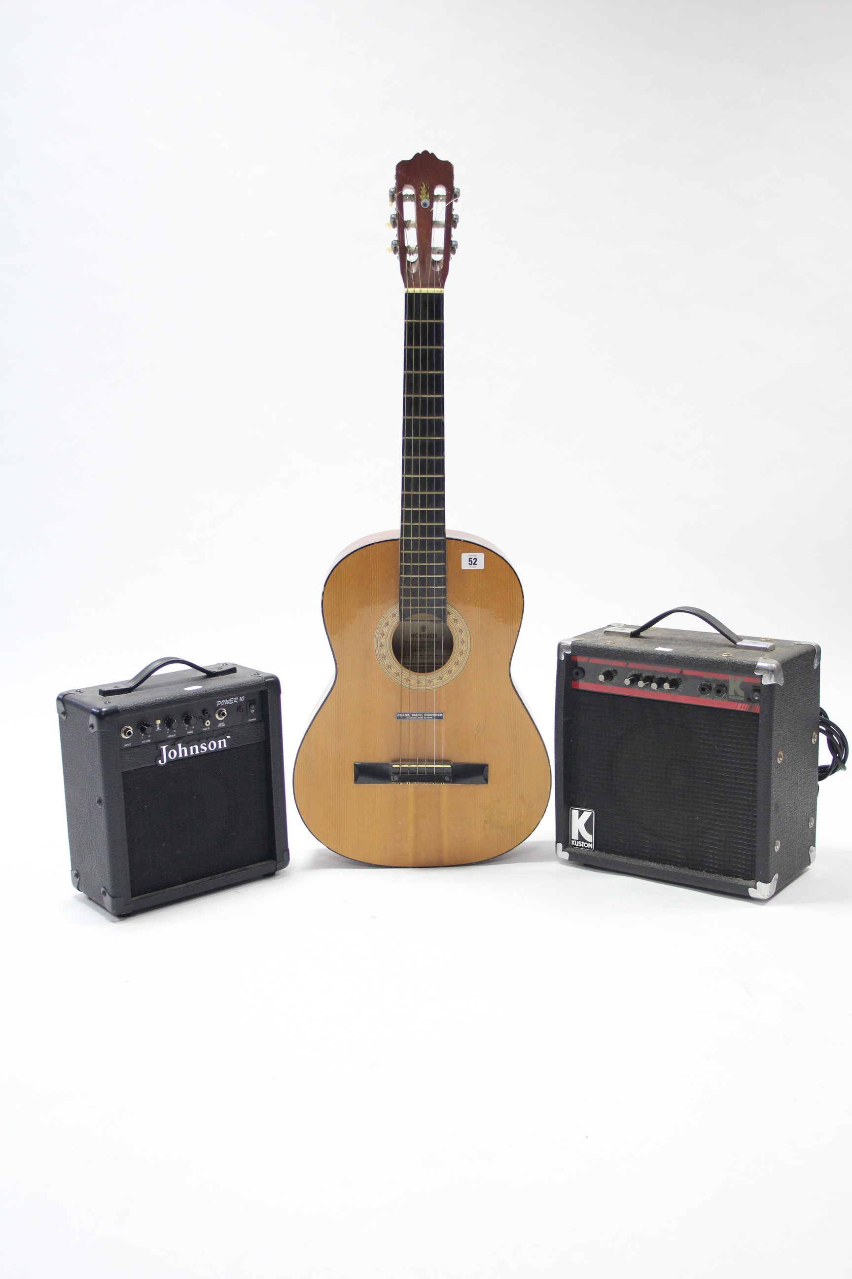 A Hohner six-string acoustic guitar (Model MC-05); & two practice amplifiers.