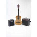 A Hohner six-string acoustic guitar (Model MC-05); & two practice amplifiers.