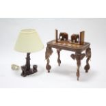 An eastern carved hardwood rectangular occasional table on elephant-head legs, 18¼" wide; a