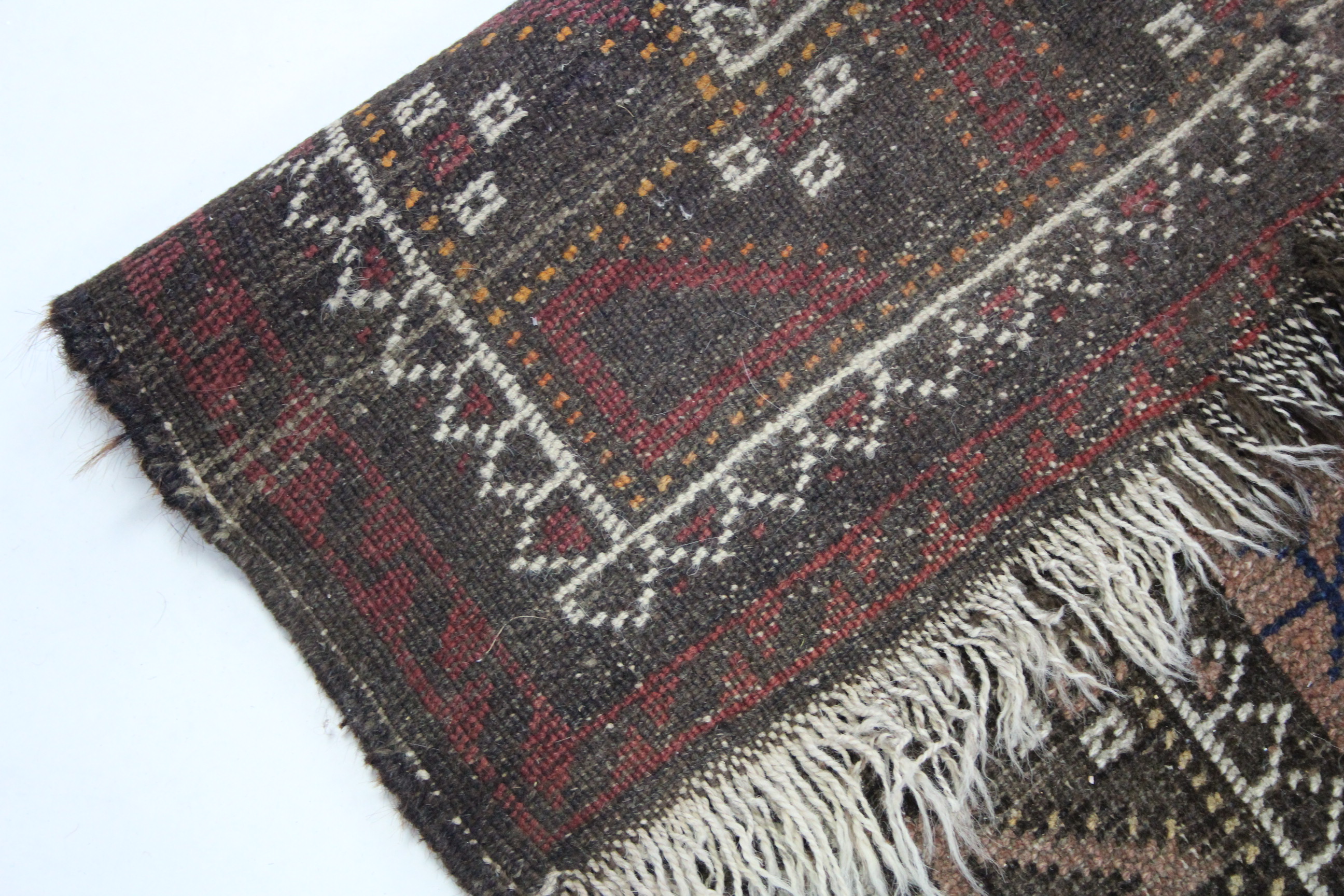 A 19th century Afghan rug of crimson ground, the centre with six rectangular geometric panels & - Image 2 of 2