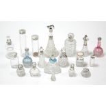 Eighteen various glass scent bottles & receptacles, each with silver mount or cover.