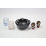 A black glazed pottery basin with blue & white floral & dragon panel decoration, 16” diam.; a pair