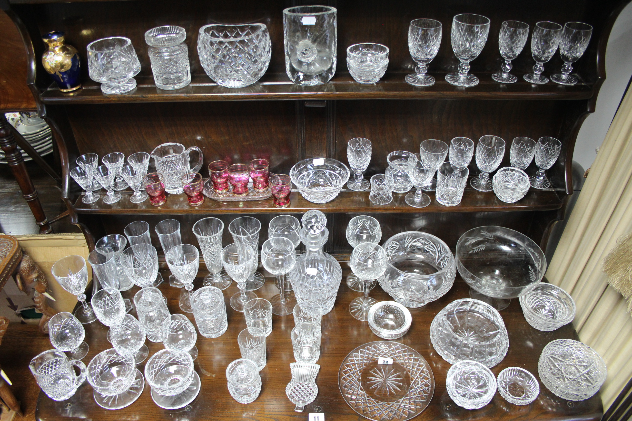 A heavy cut-glass mallet shaped decanter with faceted ball stopper; an art glass vase; & various