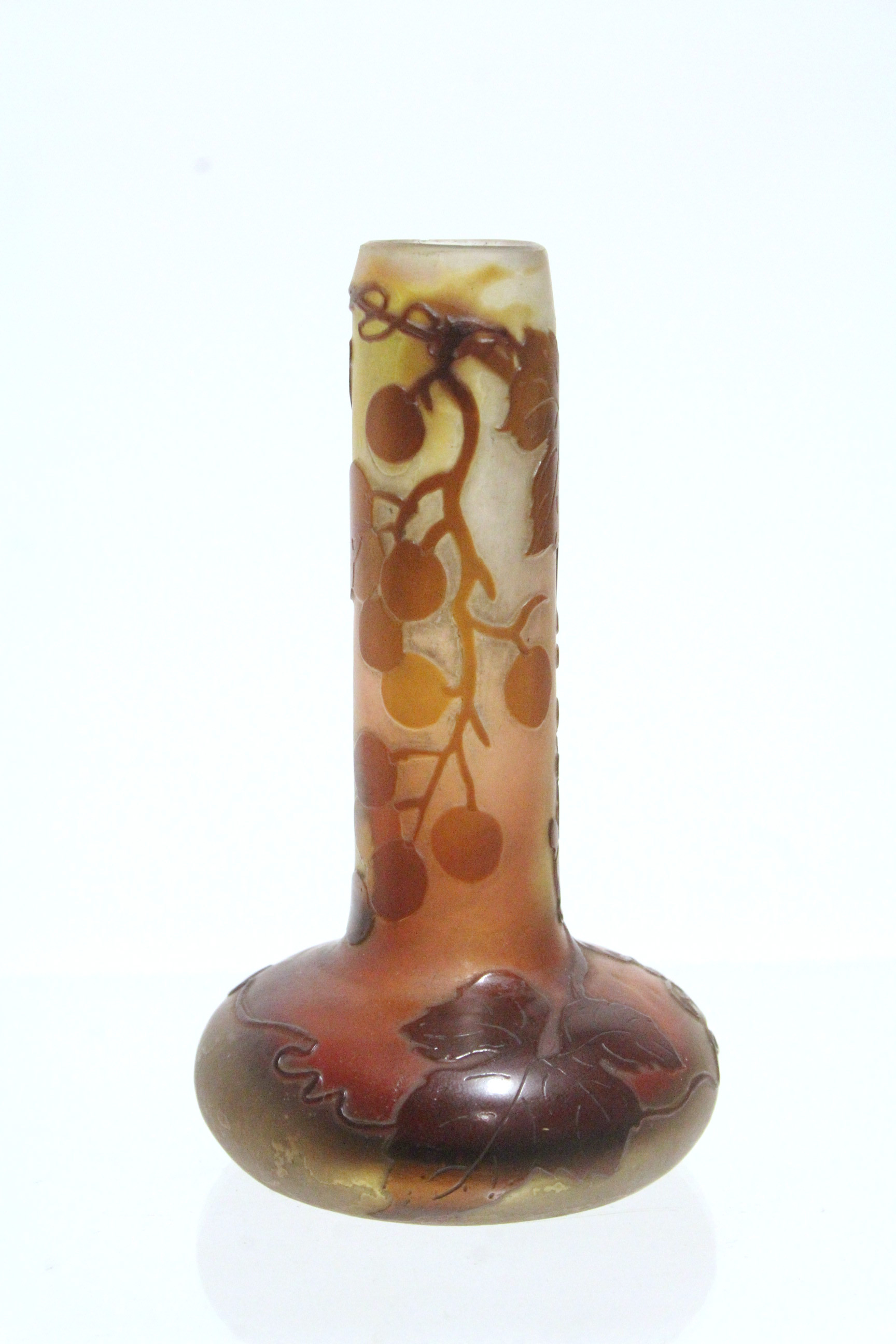 A Gallé cameo glass small vase with squat round body & tall narrow neck, decorated with fruiting